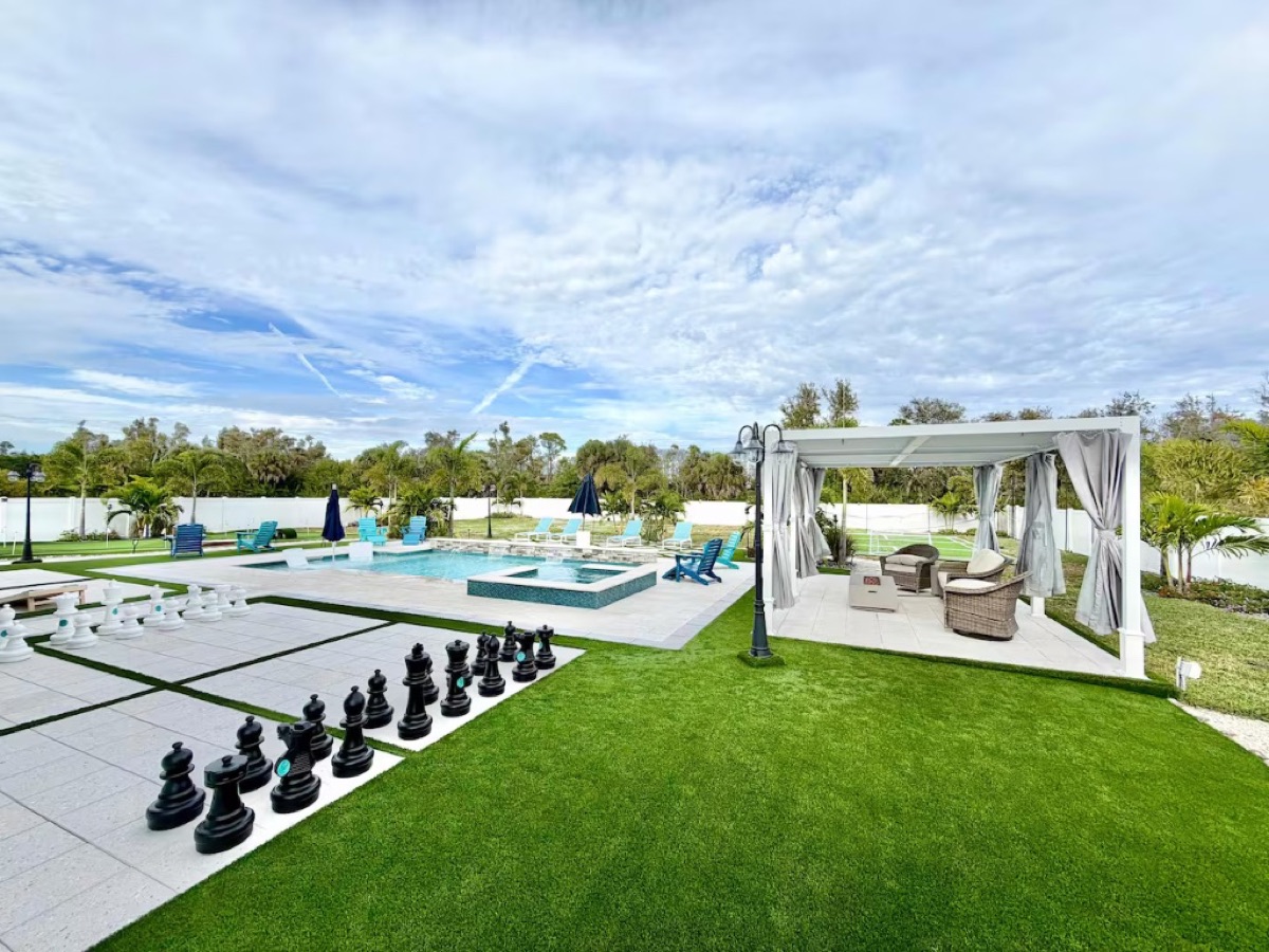 Pool deck, cabana and oversized chess