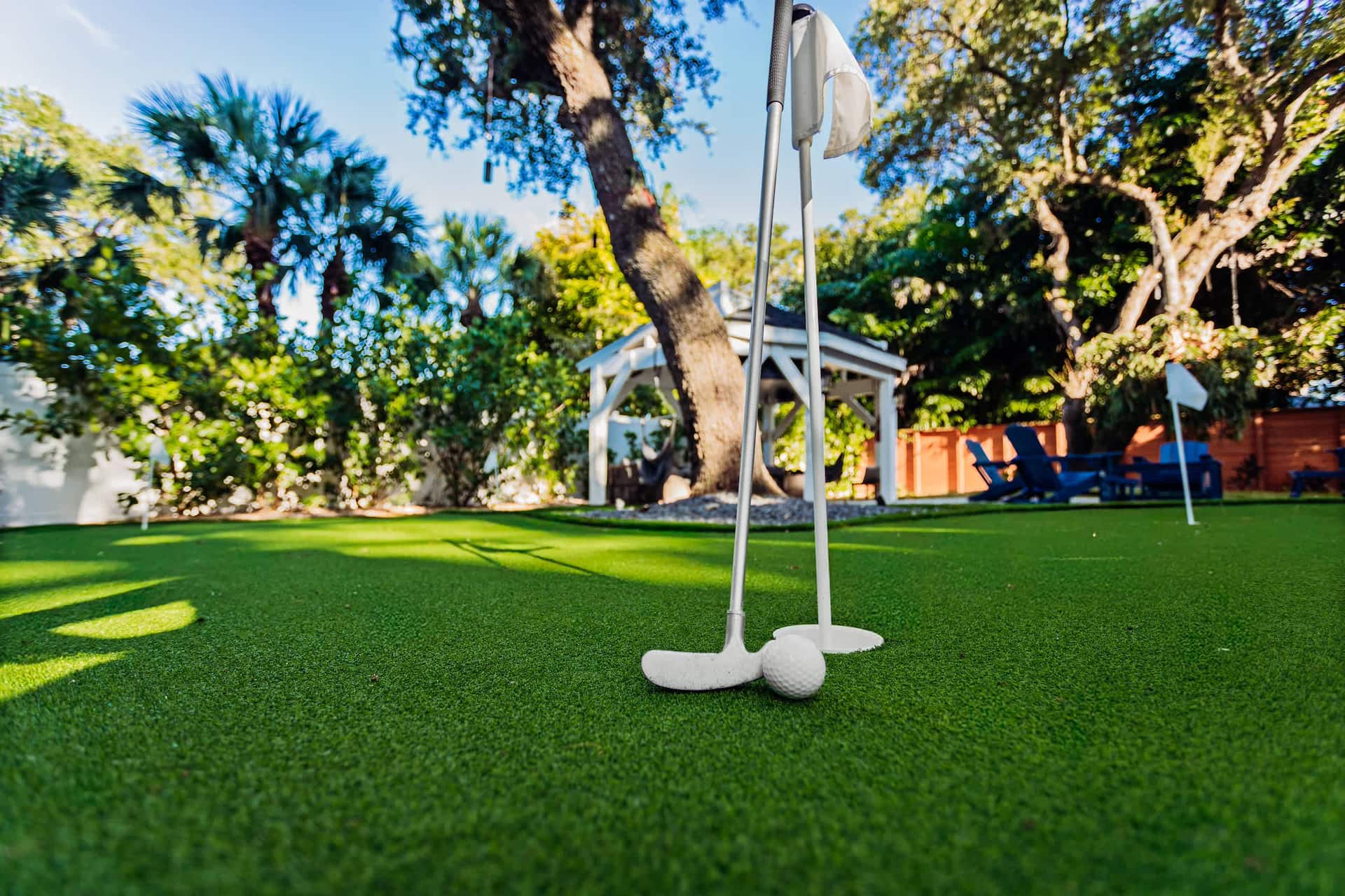 The private putting green in the Vero Oaks backyard under the oaks